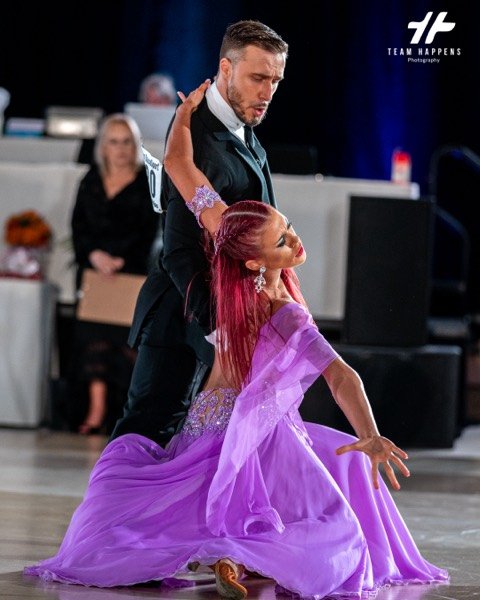 Dancer sweeping her purple dress