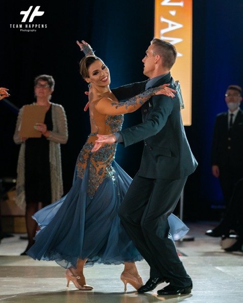 Ballroom couple under the stage lights