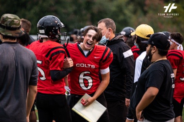 Coach talking to his players