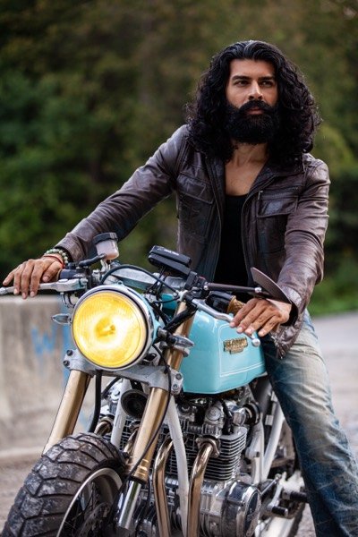 Rider in a leather jacket on his bike
