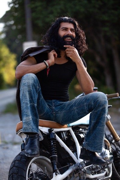 Man leaning back on his motorcycle