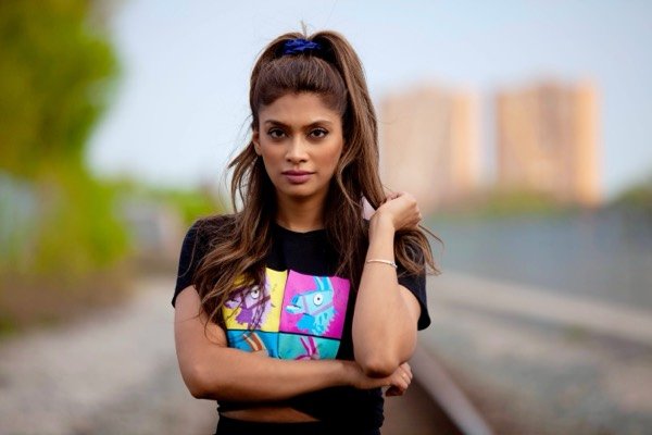 Woman by the railway at golden hour